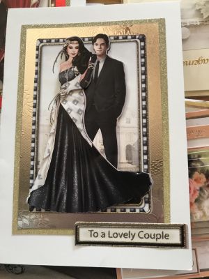 Handmade wedding card of an art deco couple