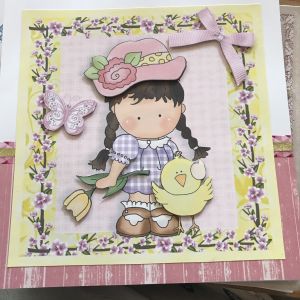 Beautiful handmade decoupage card with a little girl in a hat with duck and butterfly